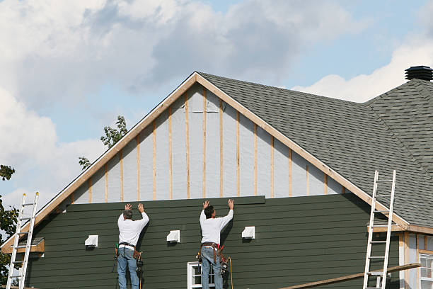 Professional Siding technician working in Villanova, PA